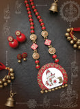 Traditional Indian jewelry set with necklace, earrings, and bangles on a dark background.