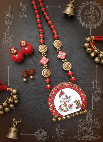 Traditional Indian jewelry set with necklace, earrings, and bangles on a dark background.