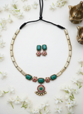 terracotta Jewelry set with necklace and earrings on a white background with flowers