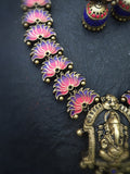 Colorful Terracotta necklace with floral designs and a large pendant on a dark background