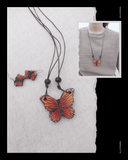Butterfly pendant  Terracotta necklace on a textured surface with a close-up inset of a person wearing it.
