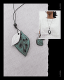 Leaf-shaped pendant Terracotta necklace on a textured surface with a close-up inset of a person wearing it.