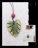 Necklace with a green leaf Terracotta pendant on a white background